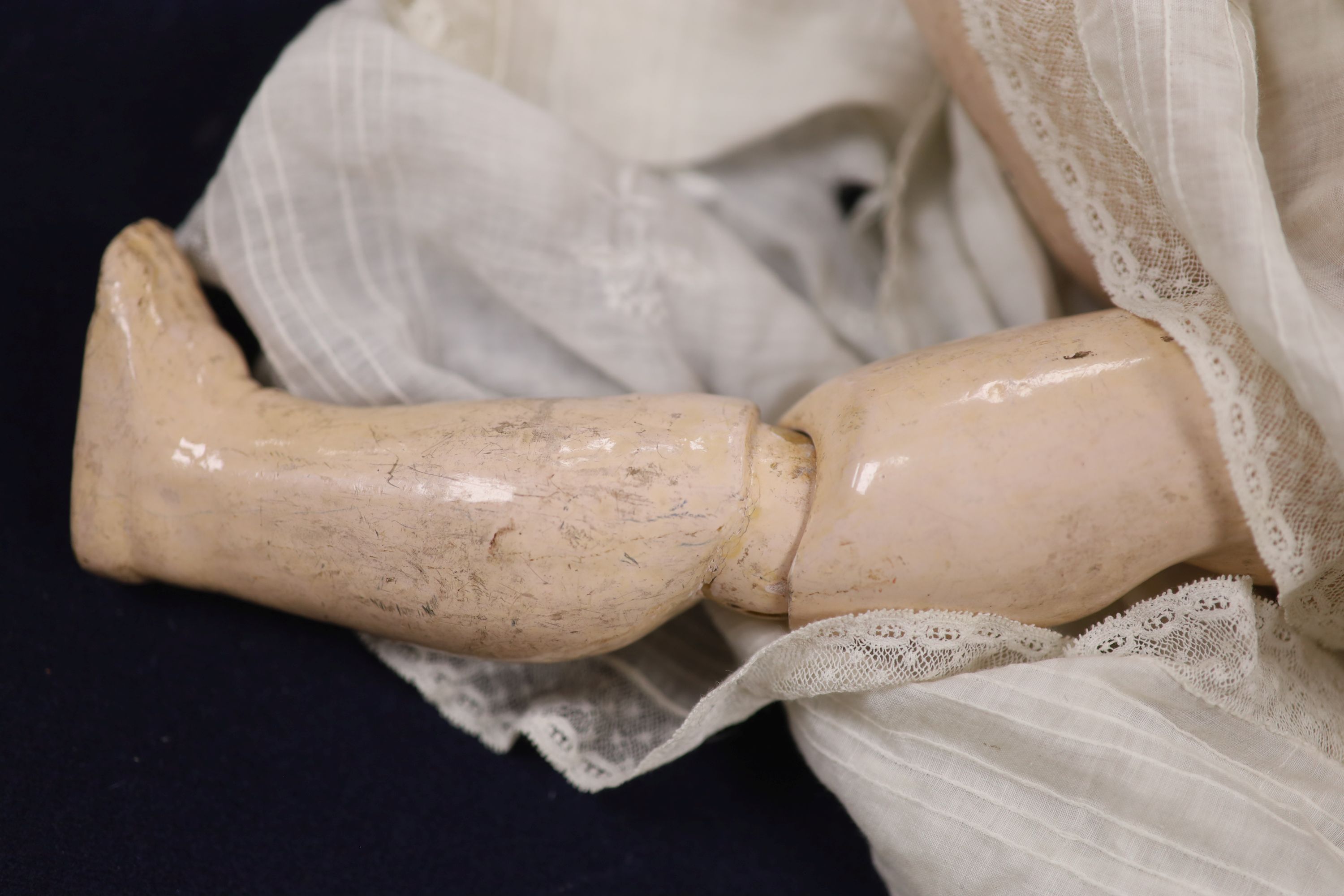 A French Mon Cheri doll, with jointed body, height 20 inches, 51cm